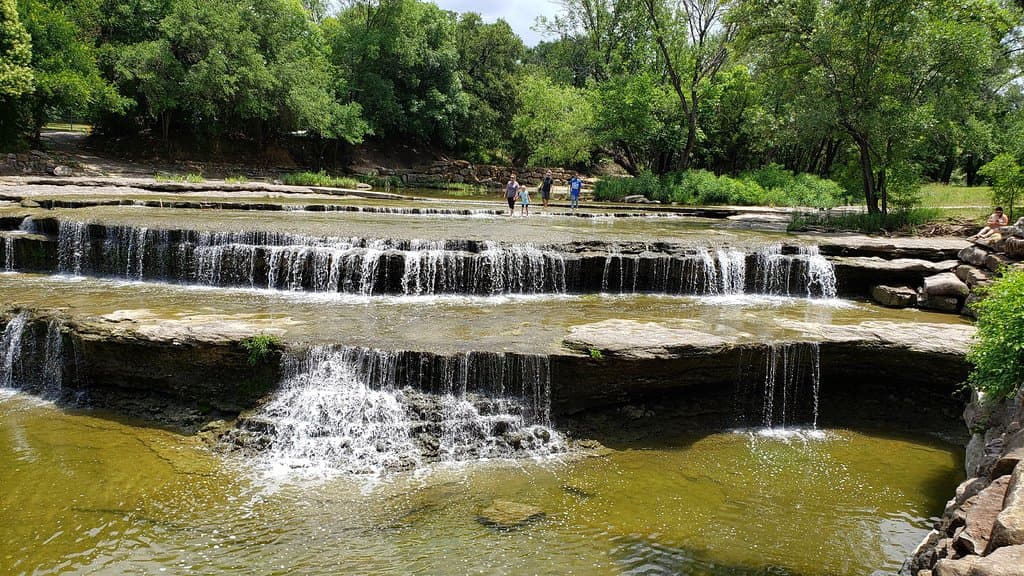The falls cascade over multiple tiers or terraces.