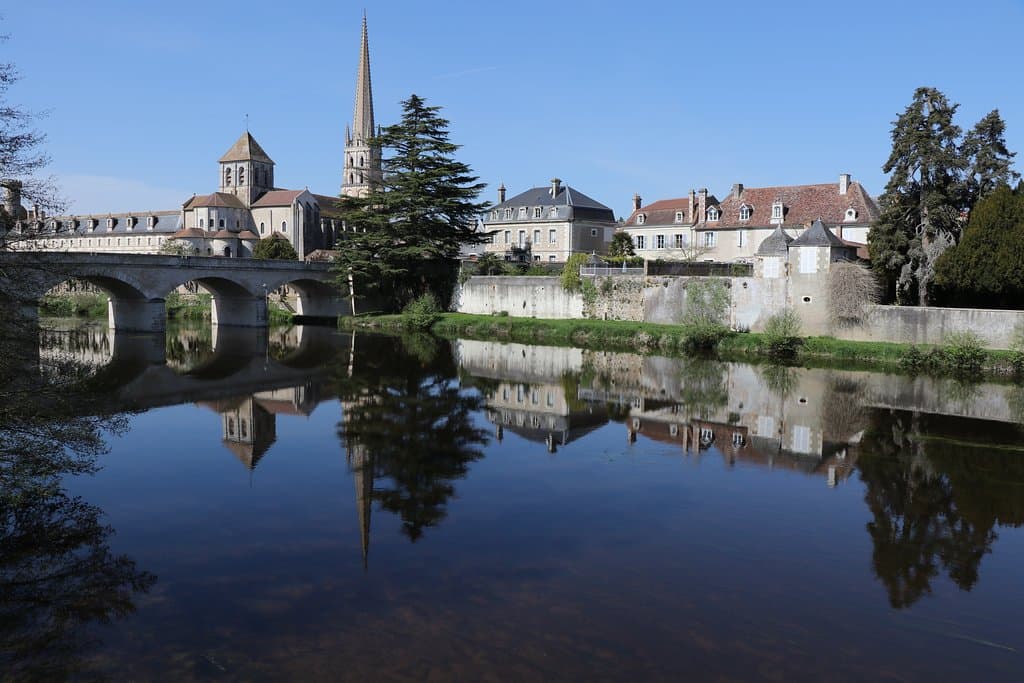 view of the abbey church and the Gartempe, standing near the river by the old bridge