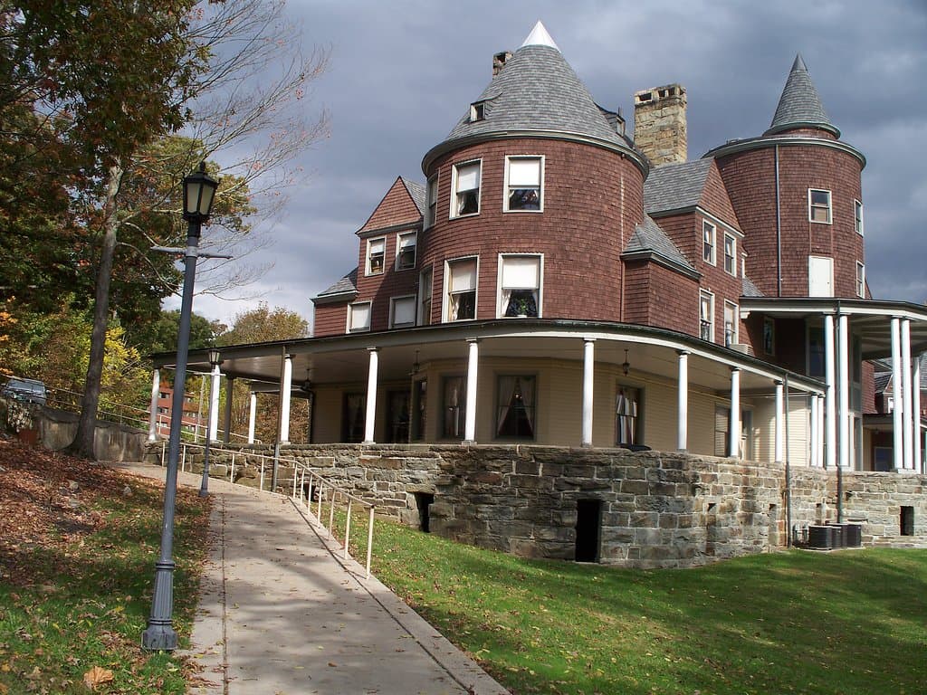 Halliehurst Mansion - walking up the sidewalk after lunch during our visit in October 2018. Notice the unusual construction of the round rooms and roof tops. Detail is amazing. Porch is massive. The view looking from porch when the house was built was breathtaking.