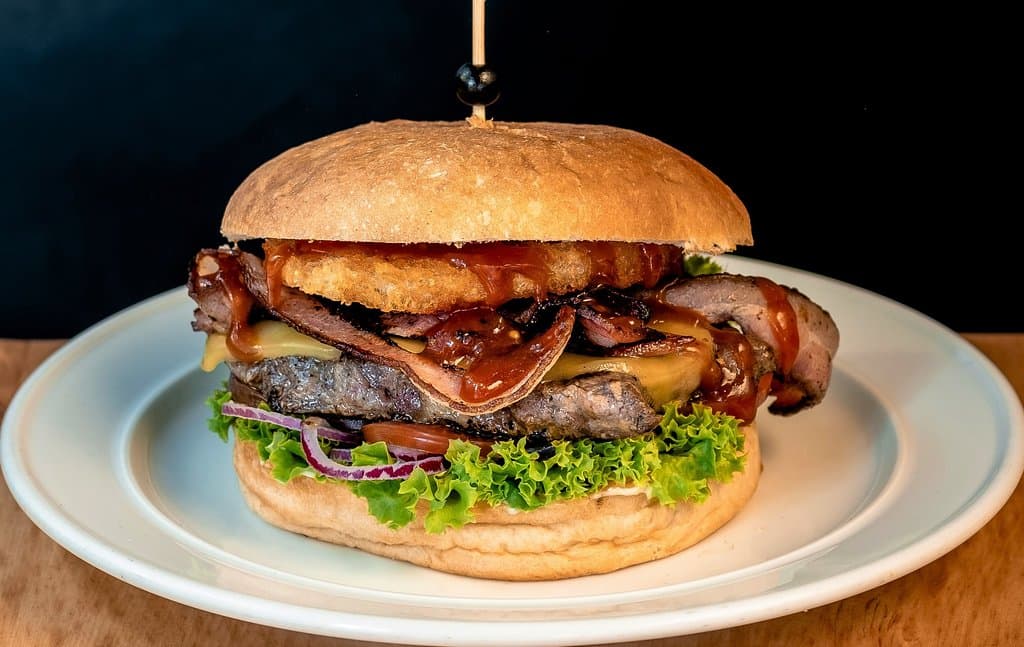 The Devils Steak Burger, Prime Ribeye Steak, Cheese, Streaky bacon, hash brown tomato relish, lettuce tomato red onion and Aioli!! A must have!!