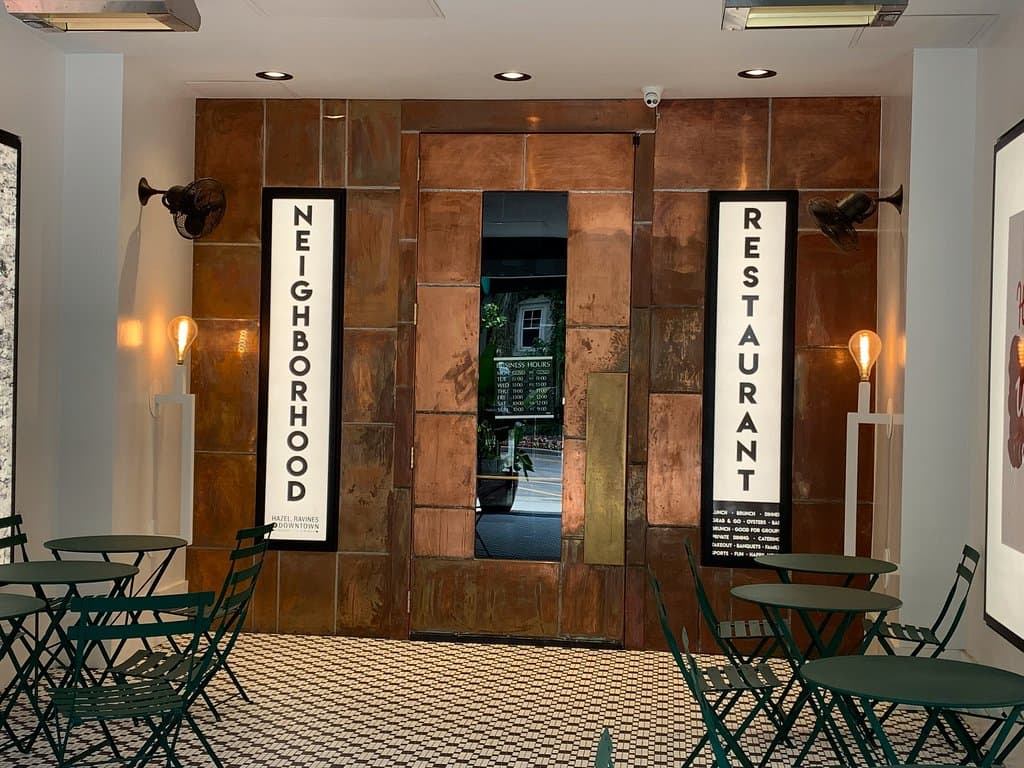 front door with covered outdoor seating