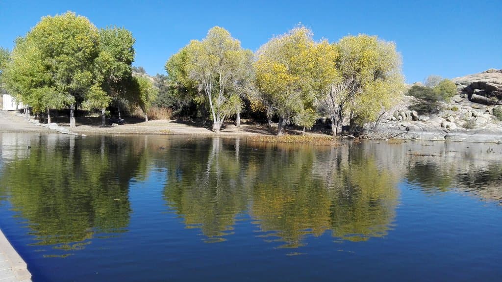 The lake is calm and quiet. It has a beautiful scenery.