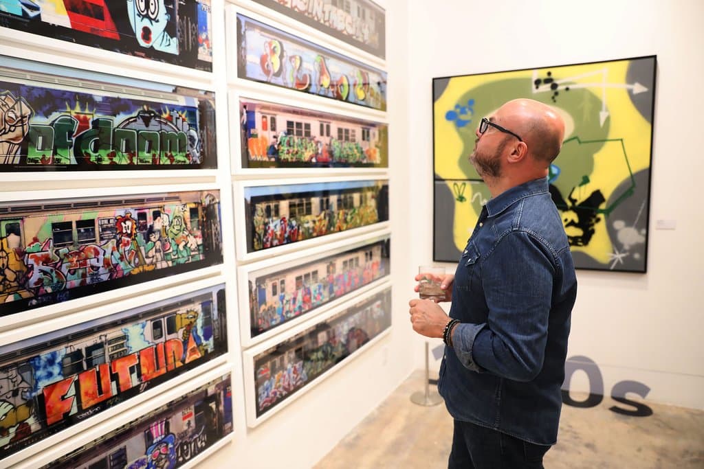 "Going All City" meant getting your name on a subway in NYC that traveled to all 5 boroughs. Photographer Henry Chalfant documented these early works on trains. His photos are on display inside the Museum