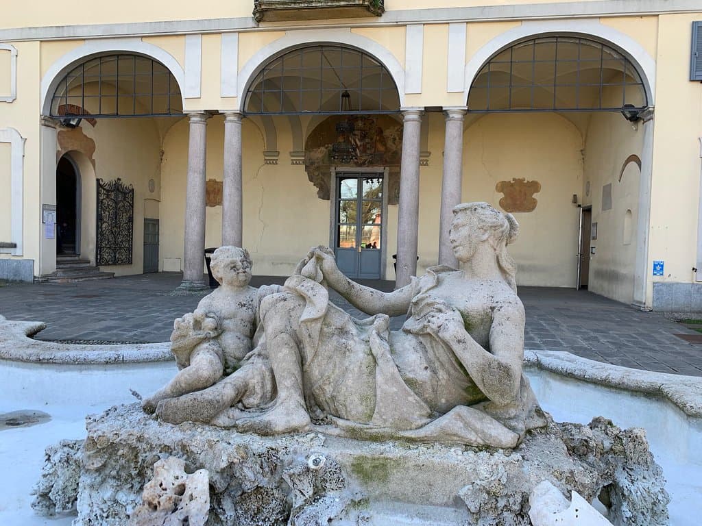 Facade, statues and wrought iron gate