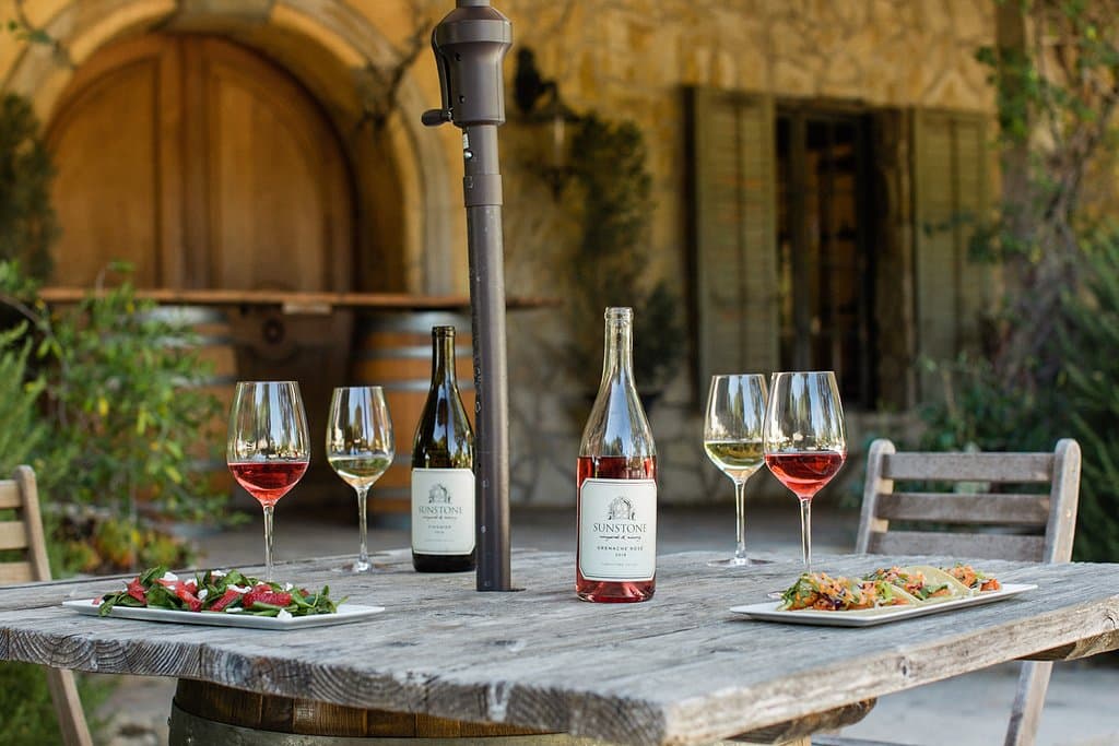 Aromas of French lavender and rosemary greet guests as they approach our winery’s our inviting courtyards, leading to the expansive picnic grounds and the gorgeous stone tasting room and barrel aging caves, recalling rustic homes and barns of the Provencal countryside.