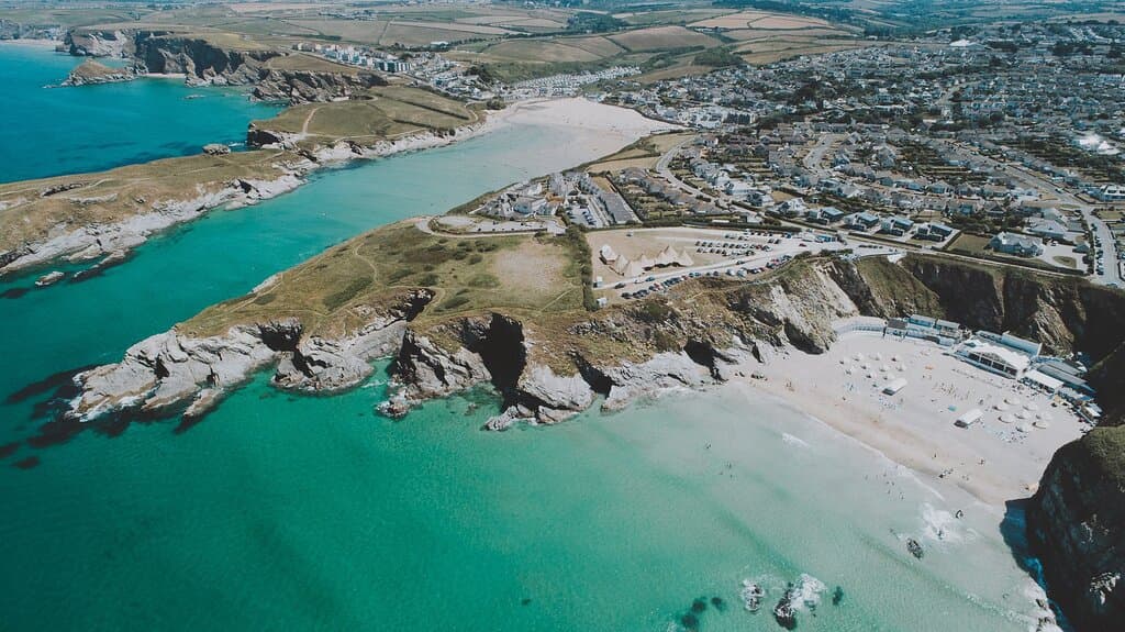 Bird's eye view of Lusty Glaze Beach, a privately-owned cove on the North Cornish coast.
