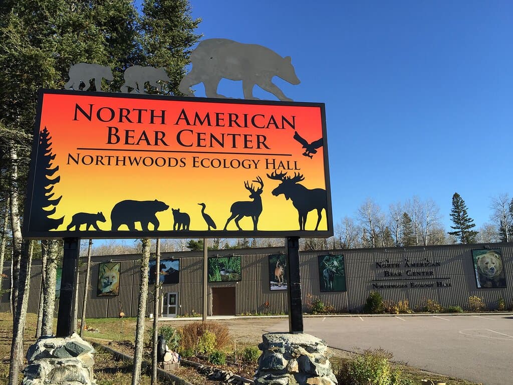 You can't miss our well-lit sign as you drive down Hwy 169.
Stop in for a visit, great things await you inside! We offer a variety of programs daily. You won’t want to miss our Free Behind the Scene tours which are available with your paid admission, good for the entire day.
Learn about trees, plants, wild bear foods, bear and animal sign while taking a casual walk on our 1/4-mile interpretive nature trails. No admission required to enjoy the trails or rest/eat under our covered pavilion.