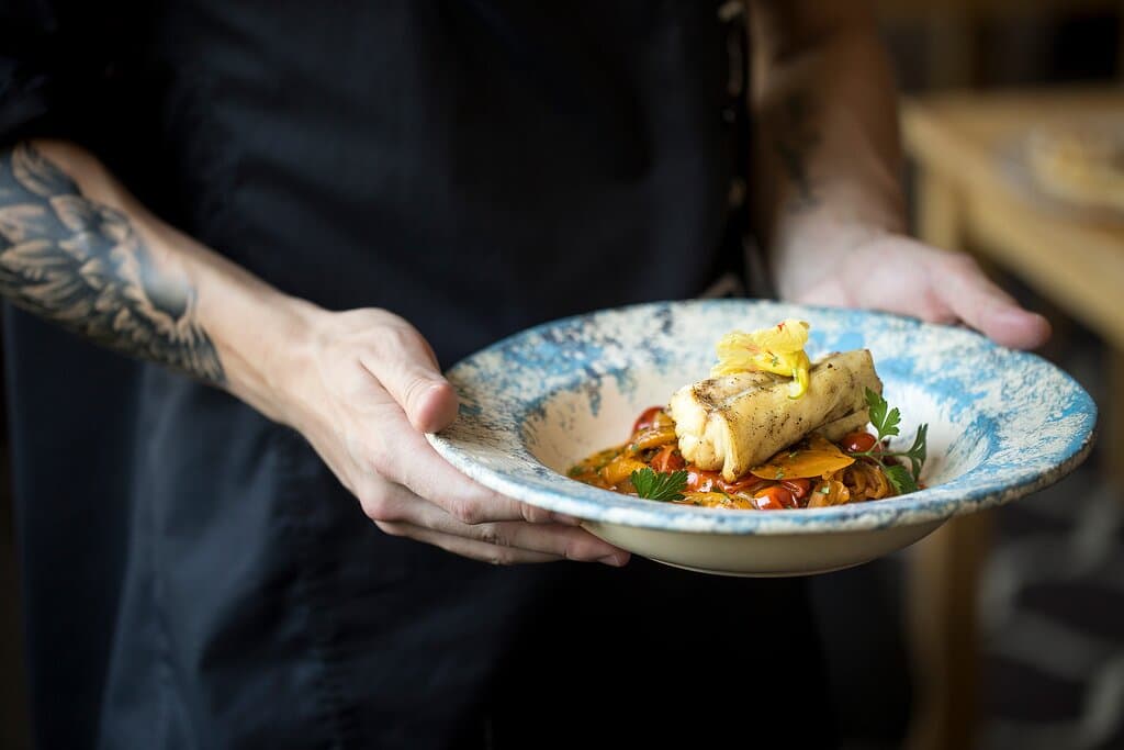 Sea bream with julienne vegetables in an olive oil-citrus emulsion