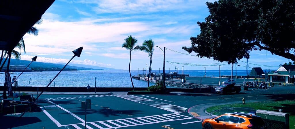 This awesome restaurant is AMAZING! your up on the second story and it's alllll open so it's good with a view. The wait staff it's AMAZING as well! We have had dinner and breakfast here the food is fantastic. They have a bar and love music. The flaming pineapple drinks are more than perfect! We celebrate to Hawaii for vacation and one goal was to find a place with a drink in a pineapple and they have it! Very much recommend!