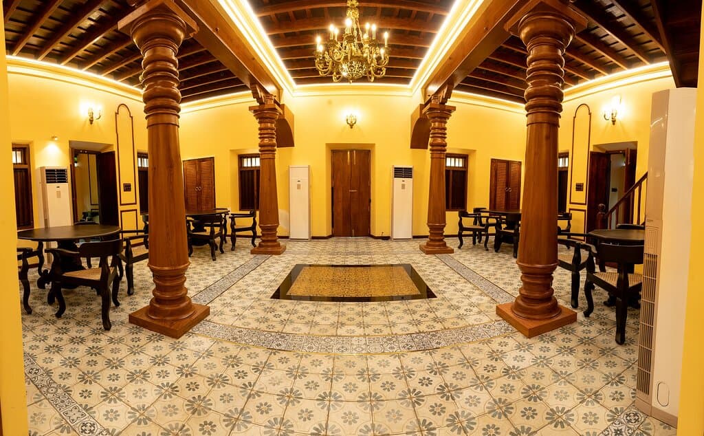 The Dinette at Chettinad Mansion by Mennakshi Vilas is beautifully lite up with chandeliers and wall lamps of forgotten years.   