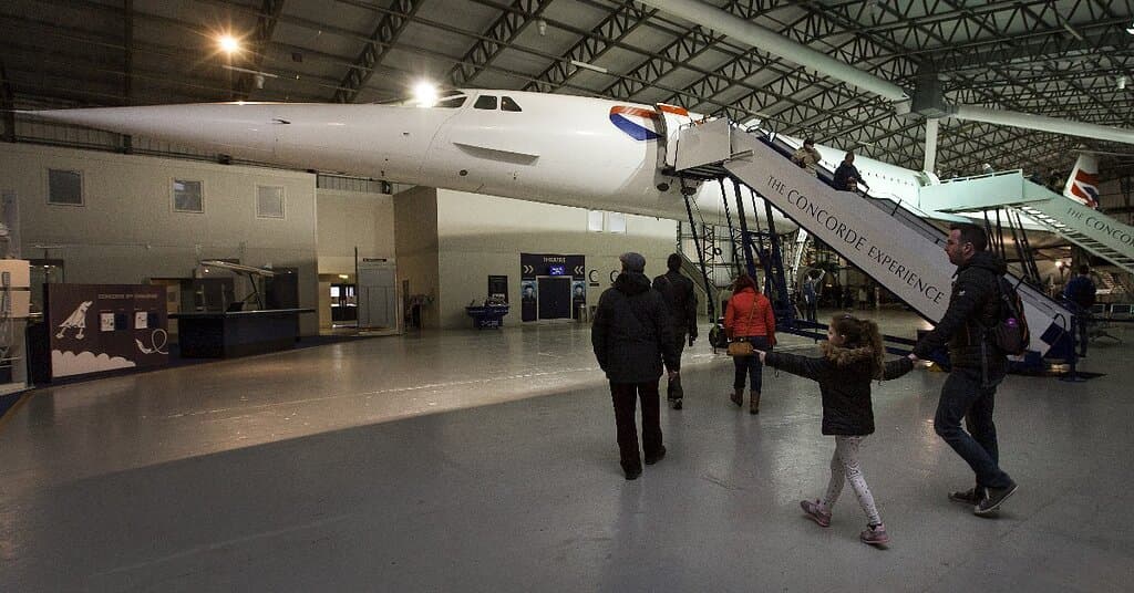 Visitors walking underneath Concorde at the National Museum of Flight © Ruth Armstrong Photography