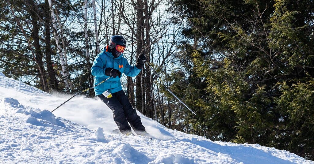 A skier enjoying great snow conditions one of our 14 runs