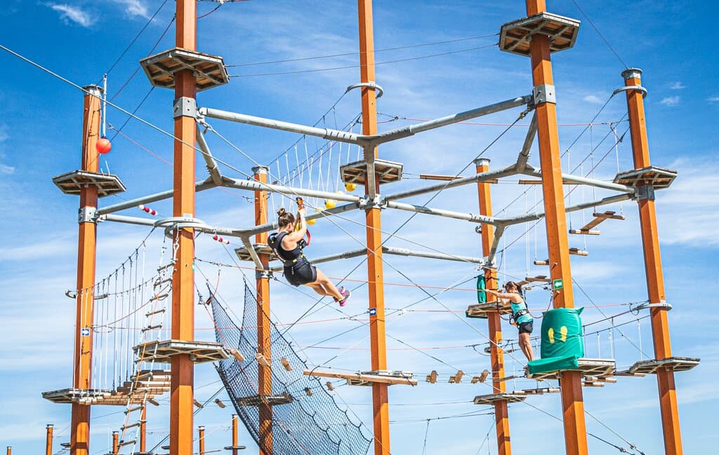 Classic Adventure Course: Rope swings, log bridges, cargo nets and ziplines. Ages 5+ | Minimum height: 4'8"