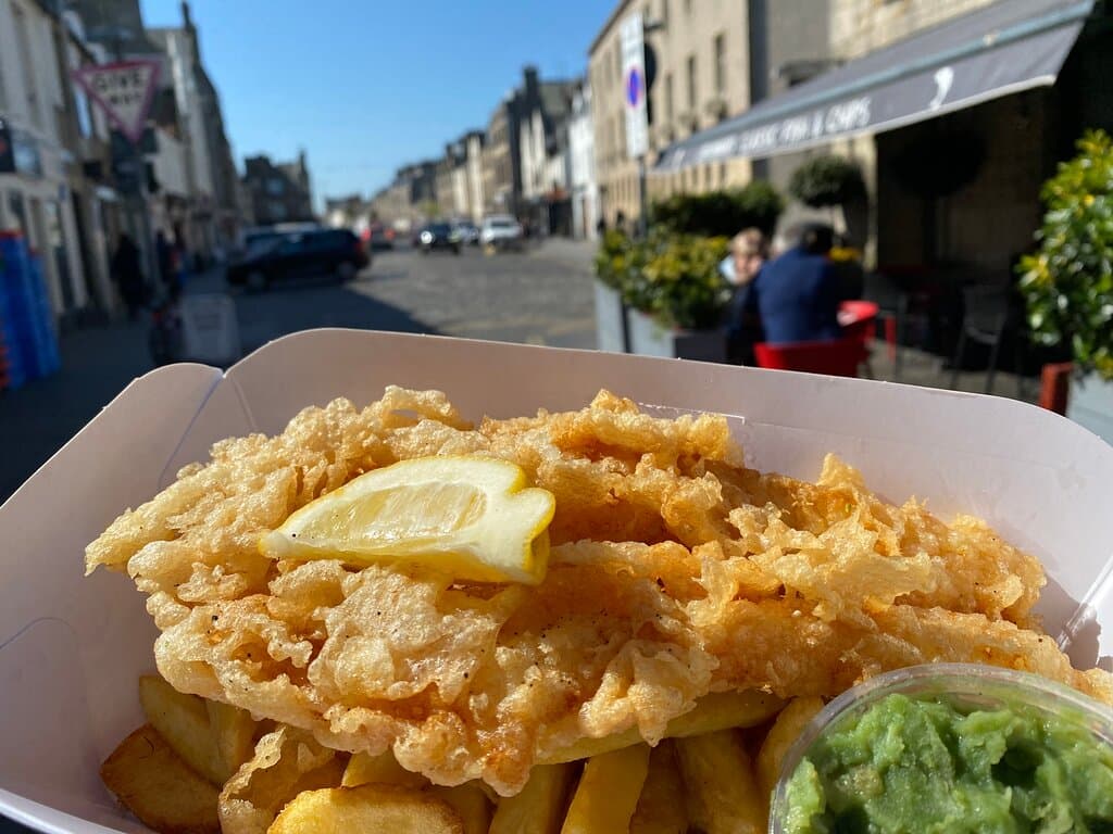 Fresh angel cut fish and chips outside Cromars chip shop in St Andrews