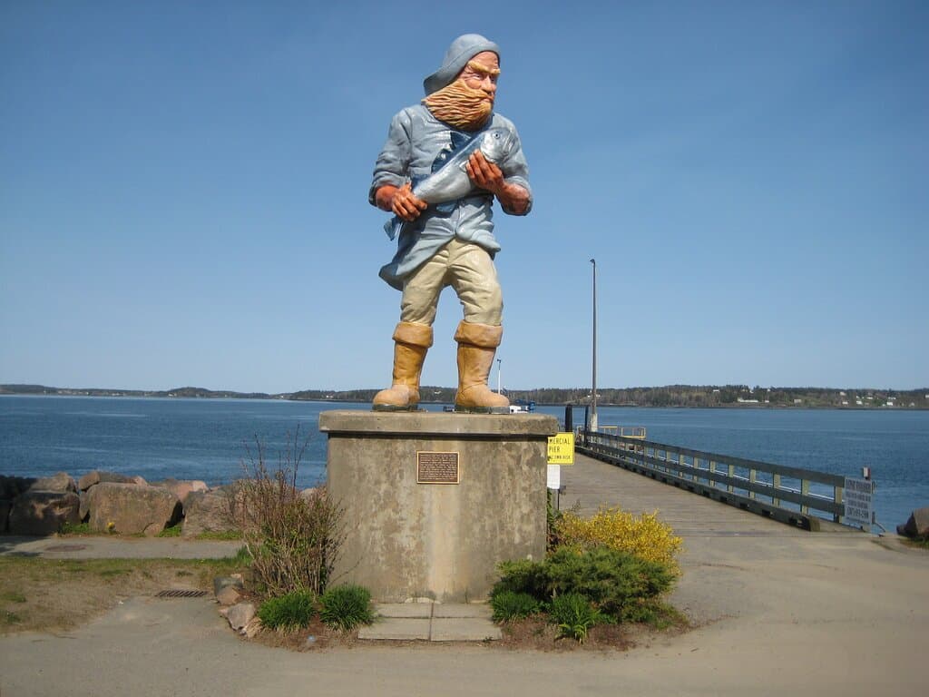 Fisherman statue right on the waterfront near the statue of the mermaid.