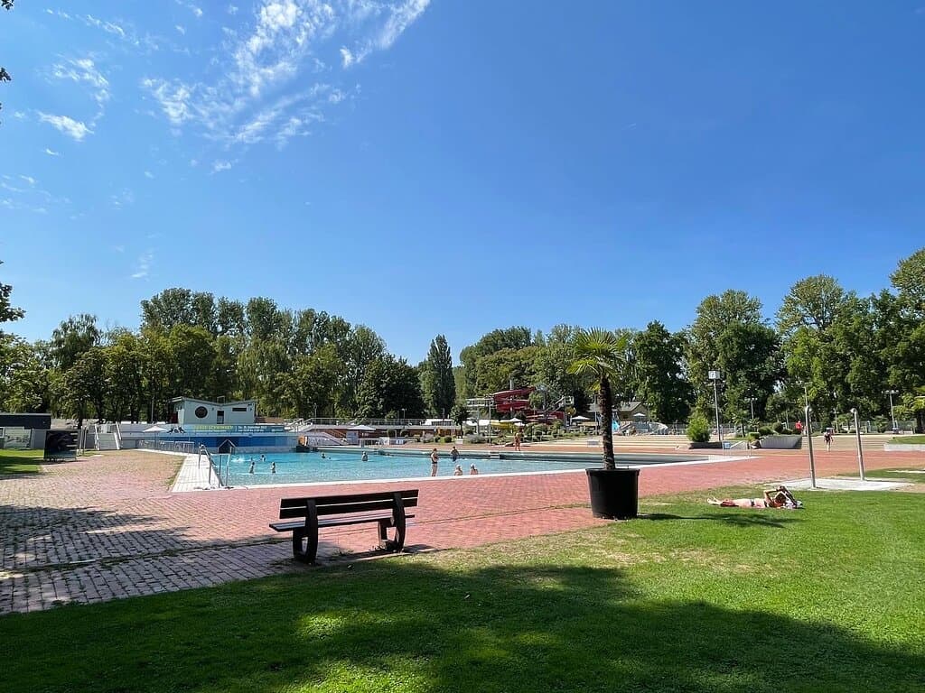 Photo from the grass of the wave pool. In the distance you might be able to see the diving boards and slides pool.