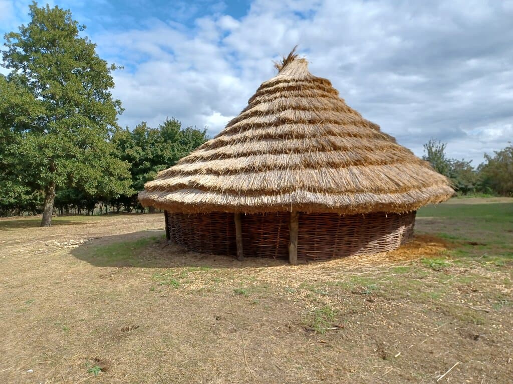 New roundhouse reconstruction, still being daubed
