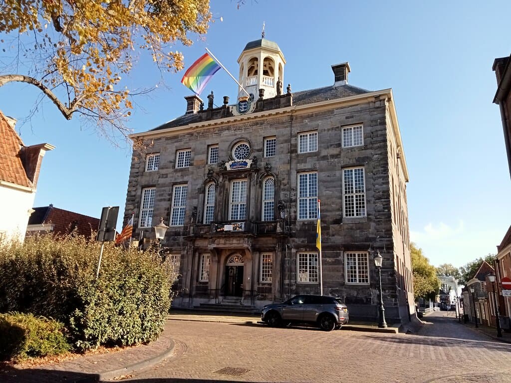City Hall with Rainbow flag, Enkhuizen, Netherlands. October 2022.