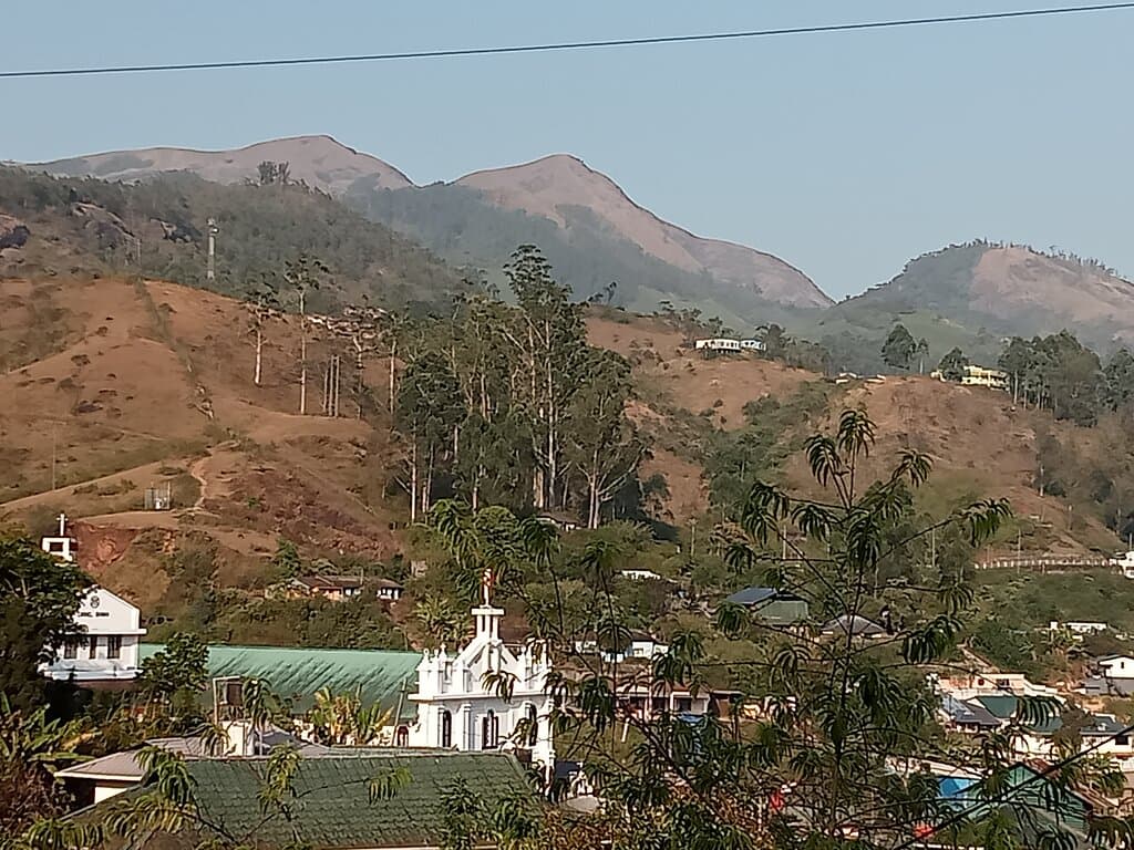 Munnar Bazaar is down from Mount Carmel church in the middle. Kerala, India. February 2023.