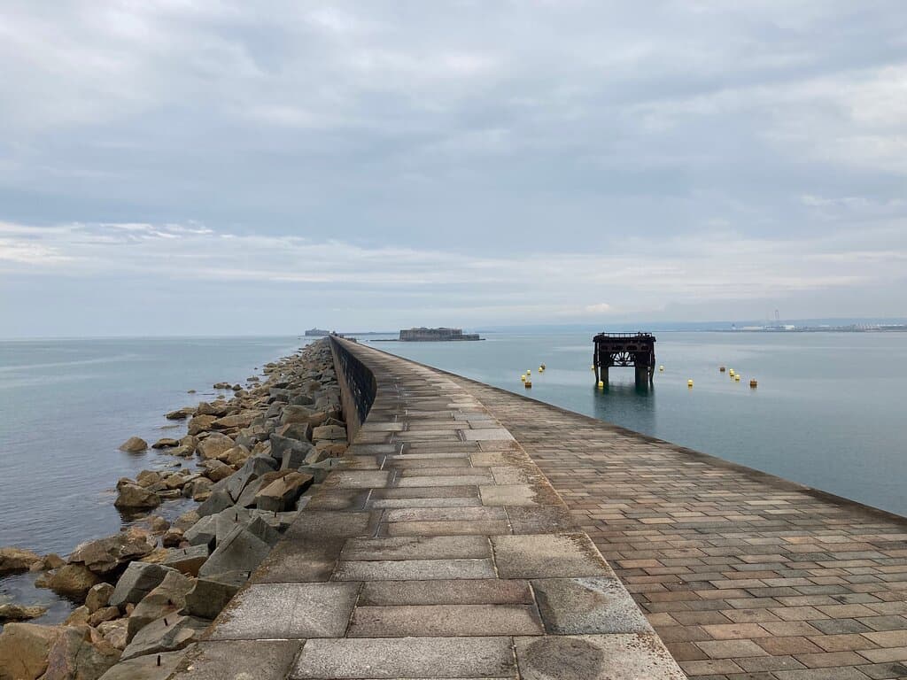 Looking along breakwater towards fort 