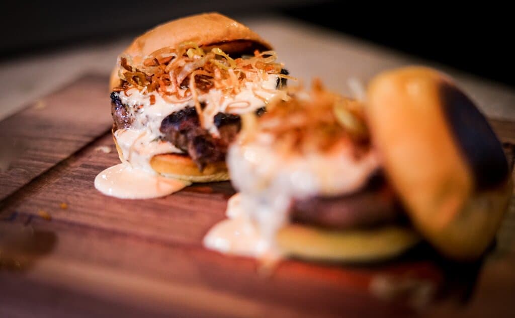 {The Famous Filet Mignon Sandwich} Two 3oz USDA Choice 21 day aged tenderloins, cooked to your liking, served with frazzled onions, bearnaise sauce on brioche buns.