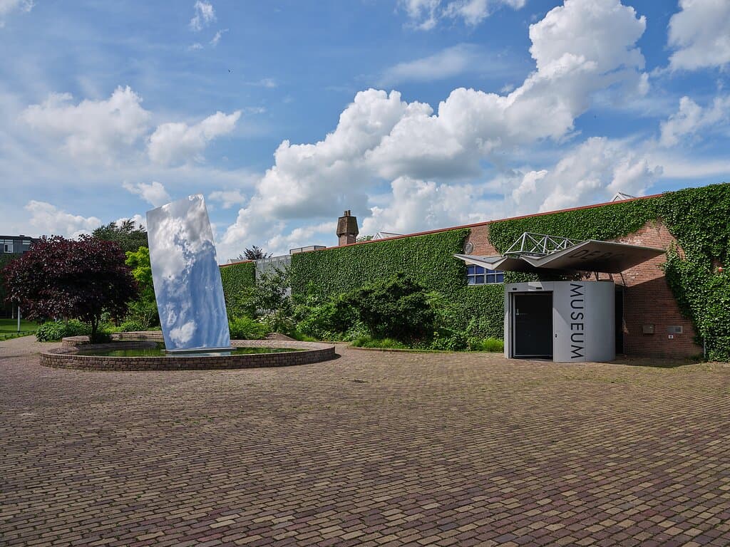 Entrance of De Pont Museum. Sky Mirror by Anish Kapoor.