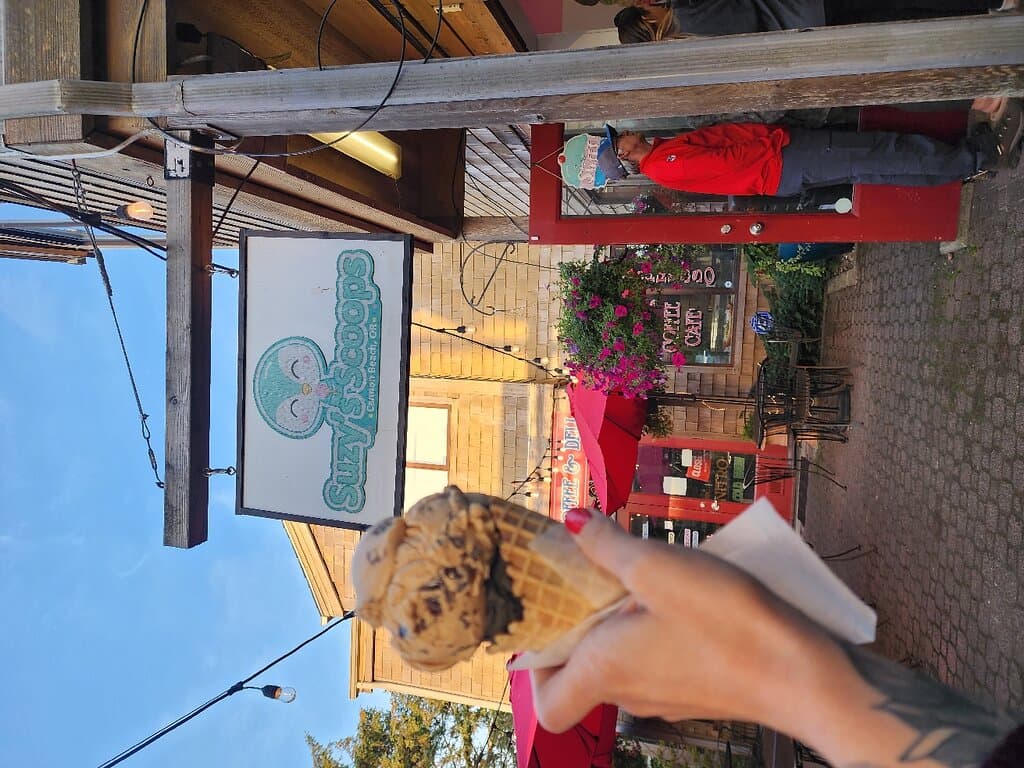This place rocks!! Hands down the BEST ice cream shop in Cannon Beach and believe me, it's my third time here so I've tried them all! She is the sweetest, most inviting and always gives BIG scoops! When my son indicated he had a gluten allergy, she immediately washed her hands, changed the scooper etc. I really appreciated that! They even offer GF cones which was even better!!! Make sure you keep this little spot in business, it'd be a shame not to!