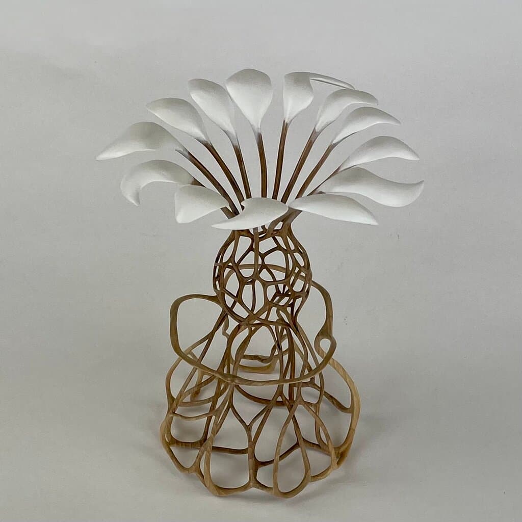 "The inspiration came from Leonard Cohen's Hallelujah with the emotions it provoked, building up from the root of the base through the soul of chords and notes being embraced by his arms and erupting from his mind into euphoria. "Hallelujah"  Made from a single piece of wood.