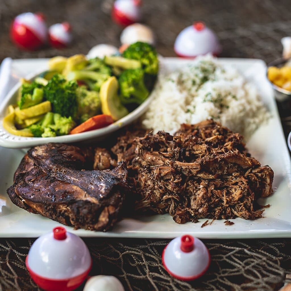 THE JERK COMBO, SLOW ROASTED JERK CHICKEN ON THE BONE OR SLOW ROASTED JERK PULLED PORK. SERVED WITH JERK SAUCE, MANGO SALSA, JASMINE RICE AND CHOICE OF SIDE. CAN’T DECIDE BETWEEN THE TWO? TRY A COMBINATION OF JERK CHICKEN AND JERK PORK!