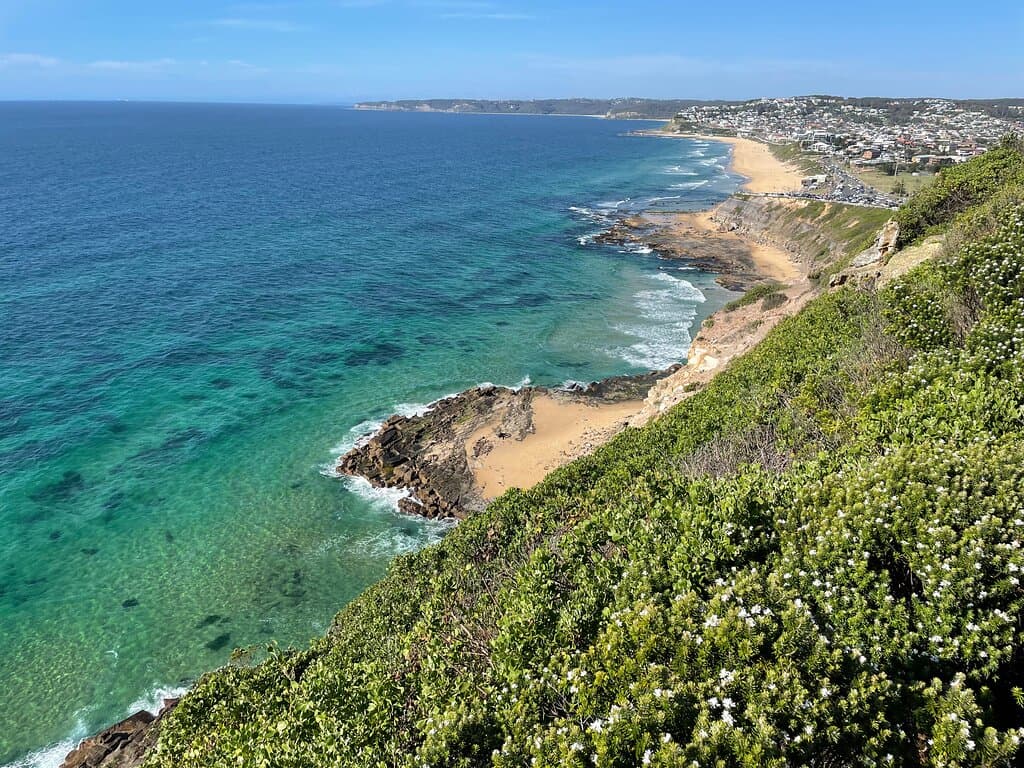 On one side, Strzelecki Lookout looks down over the city and sprawling suburbs of Newcastle and on the other side, the view is of the coastal cliffs and beaches.