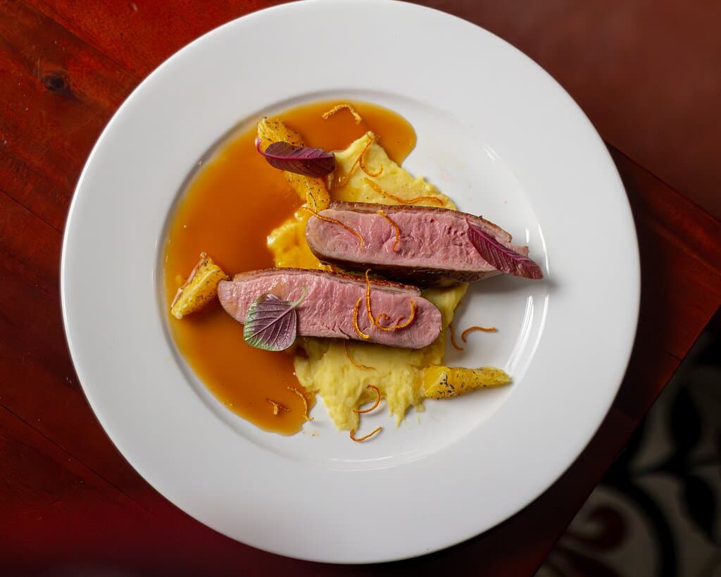 Our Chef marries tender duck leg, slow-cooked to perfection, with the aromatic essence of rosemary-infused apples to present you with this delectable Duck Confit 🍴💯 one of The Refinery's biggest stars featuring rich, savory, and subtly sweet notes. A true hit that you can't miss!