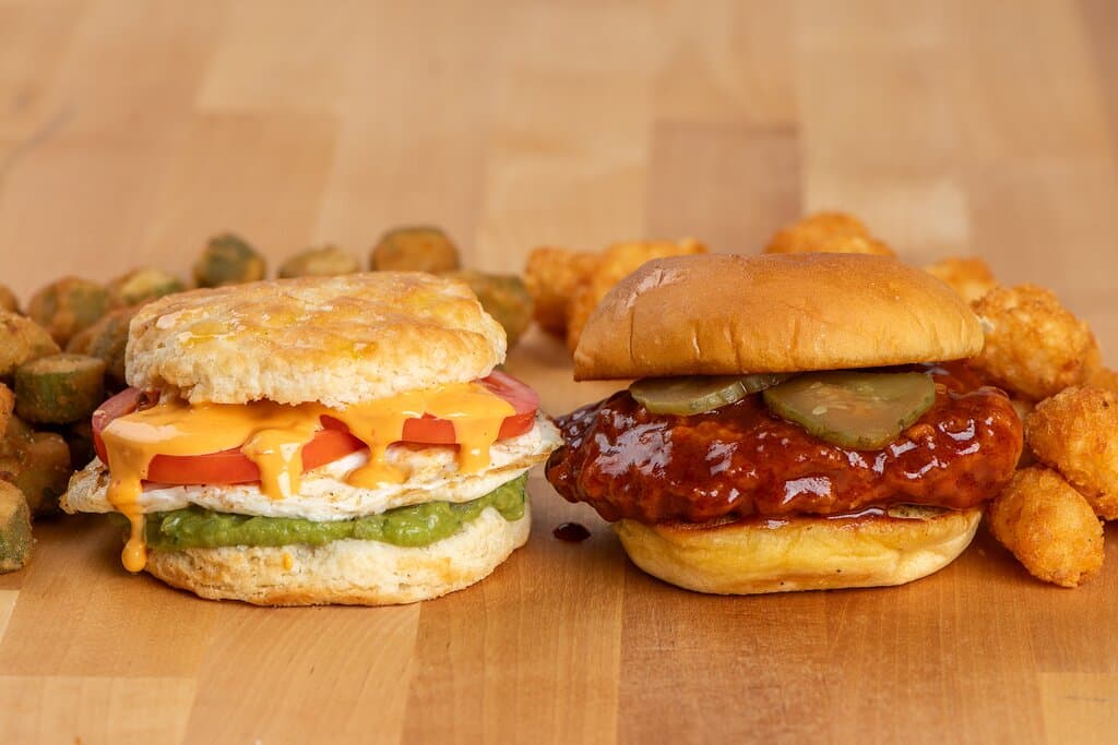 Our Guacamole Smash on a buttermilk biscuit, and our Nashville Hot Chicken on a potato bun.