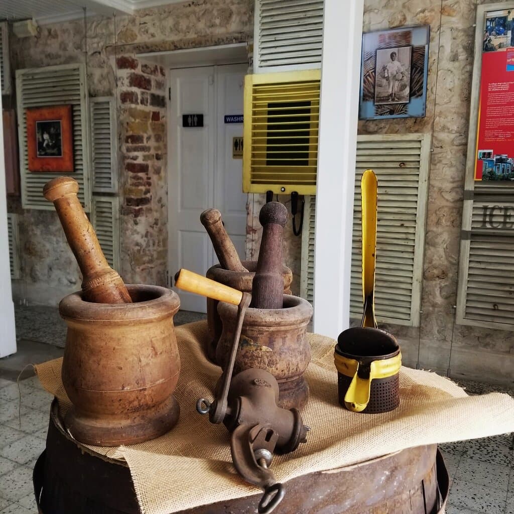 This display showcases a few gadgets used in the olden days to prepare meals