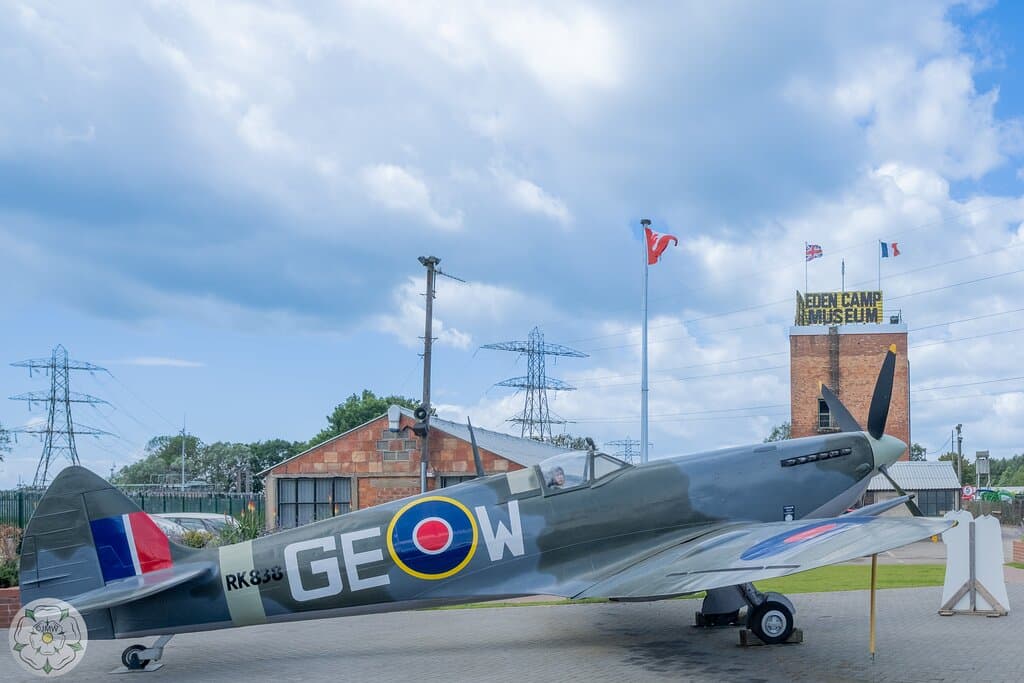 Airfield with a sign in the background.