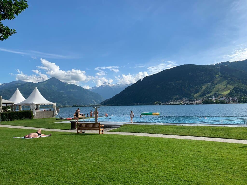 A clean, manicured beach with an infinity pool, a restaurant... Predominant colors are blue and green, colors that are friendly to the eye, colors of the aurora Borealis..., July 2024