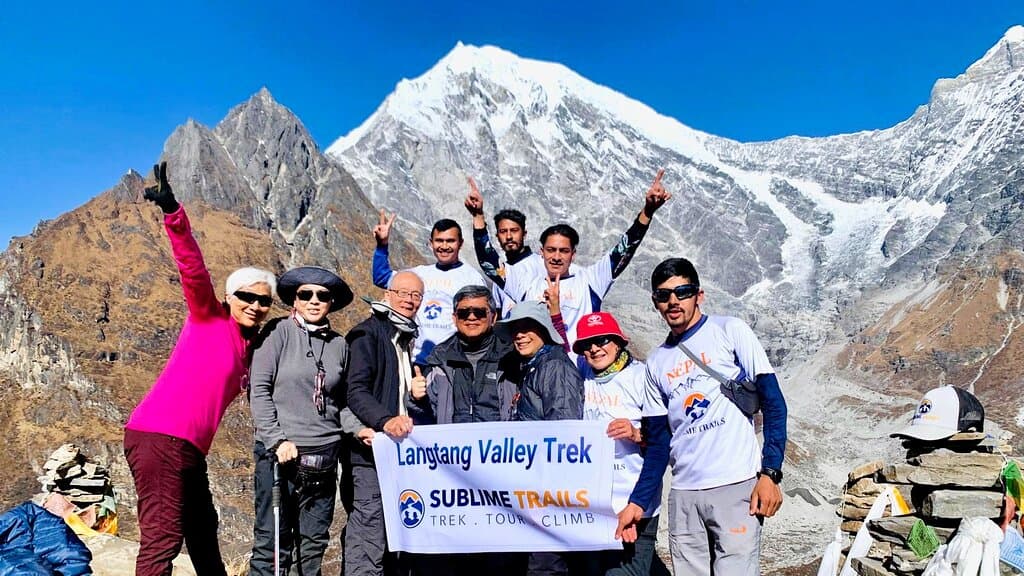 At the summit of Lower Khanjin Ri with Bibek and the porters