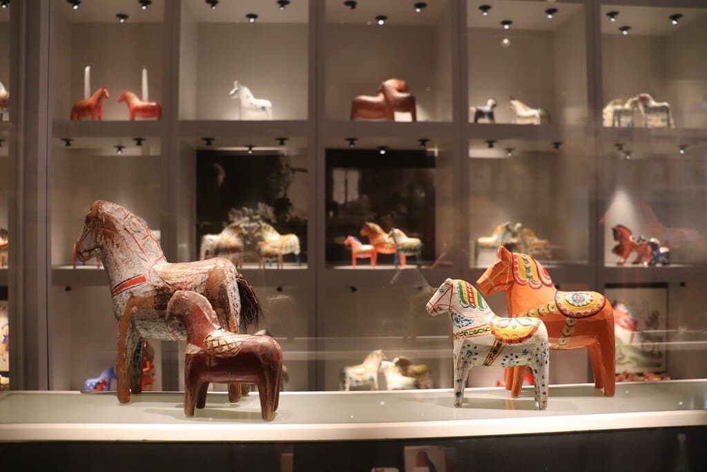 Painted wooden horses in the Dala horse exhibition.