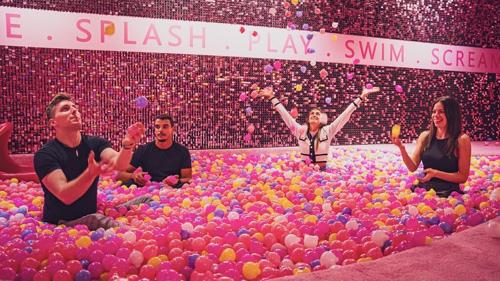 Dive into a playful oasis of oversized gummy bears and colorful treats.