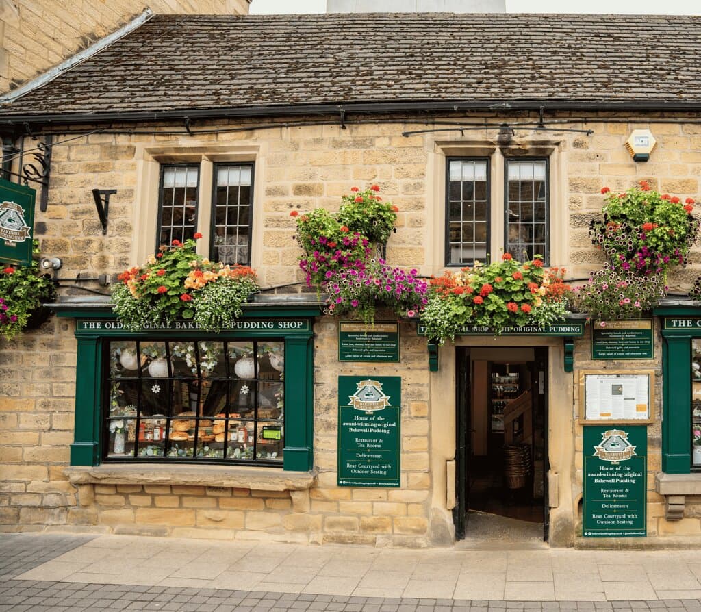 Located in the heart of the vibrant market town of Bakewell, within the picturesque Peak District National Park, The Old Original Bakewell Pudding Shop has been a beloved landmark since 1860.