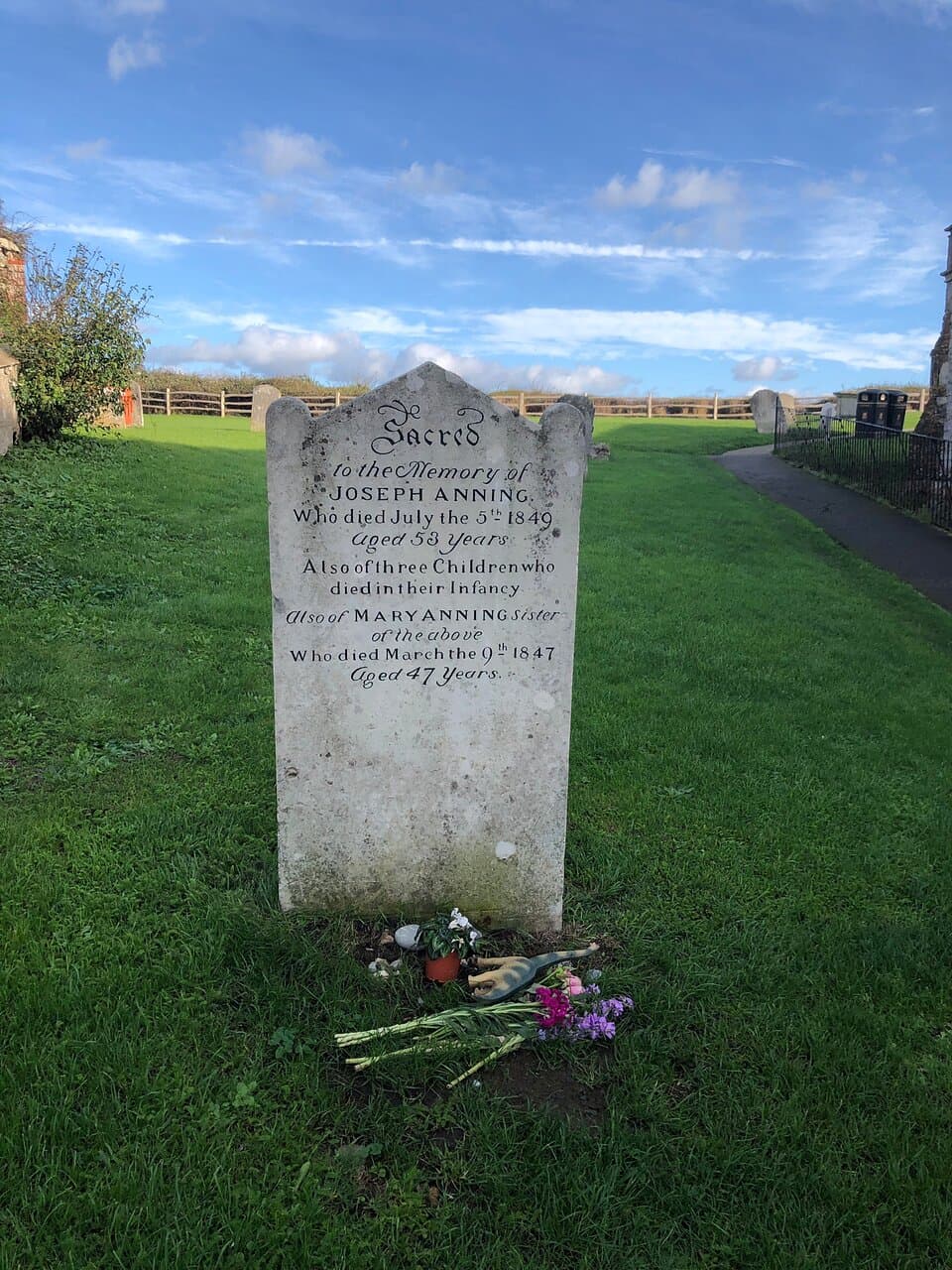 The grave is at St Michael’s church in the centre of the town. The grave stone of Mary Anning and her husband can be found on the left hand side of the path. The church will be on your right Walking to the top of the graveyard there’s the most stunning views across Lyme Bay and the Jurassic coast as far as the eye can see. Worth a little look if you’re in the town.