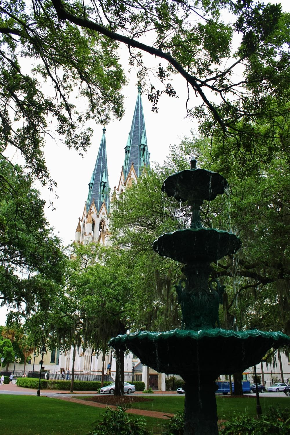Fountain with steeple in view.