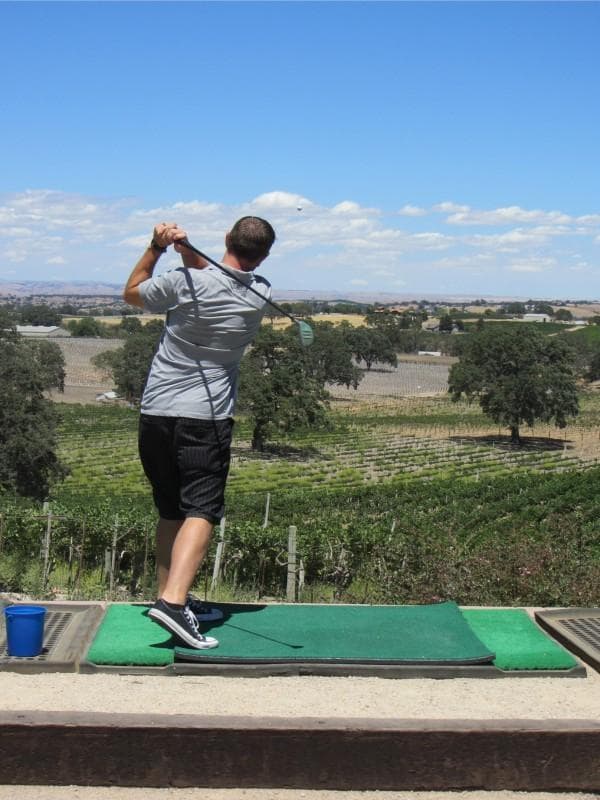 Hitting Golf Balls into the Vineyard