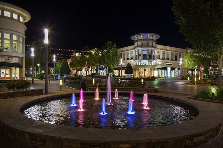 The fountain at the center of the mall, at night.