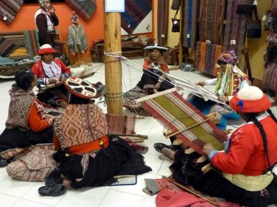 Area artisans weaving in the back of the store, photos welcomed.