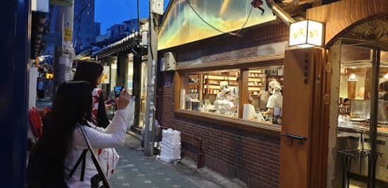 a lot of people amazed taking photos from outside