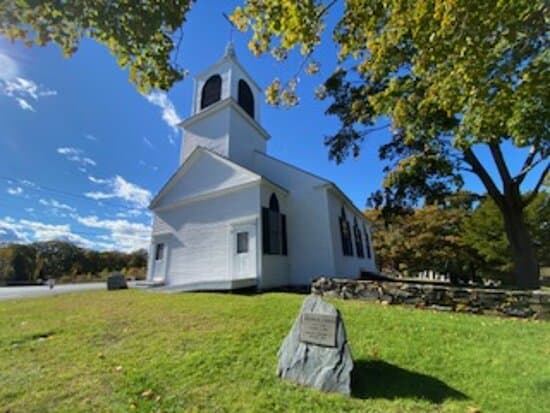 Spurwink Congregational Church with National Register of Historic Sites stone marker.