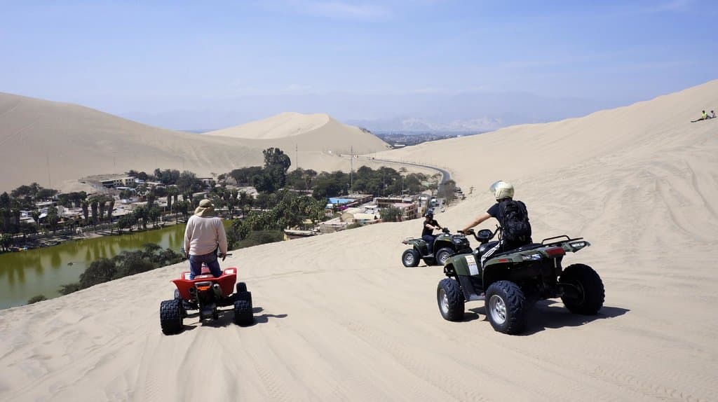 Dune buggying near the oasis (in Huacachina, Ica, Peru)