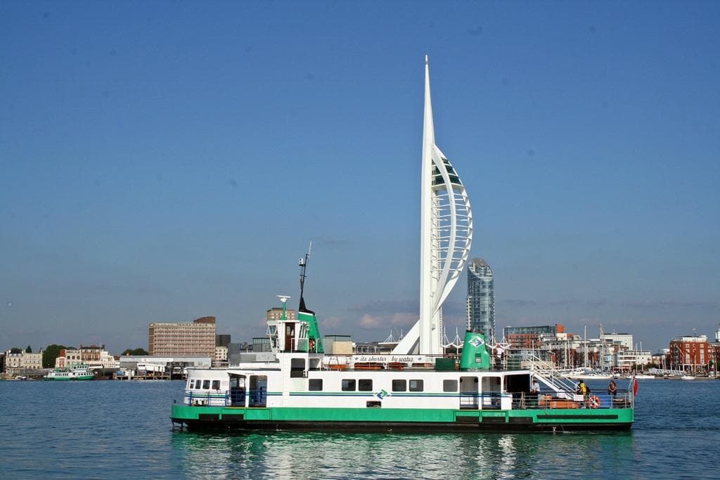 A Gosport Ferry on its way to Portsmouth with the famous Spinaker Tower in the background.