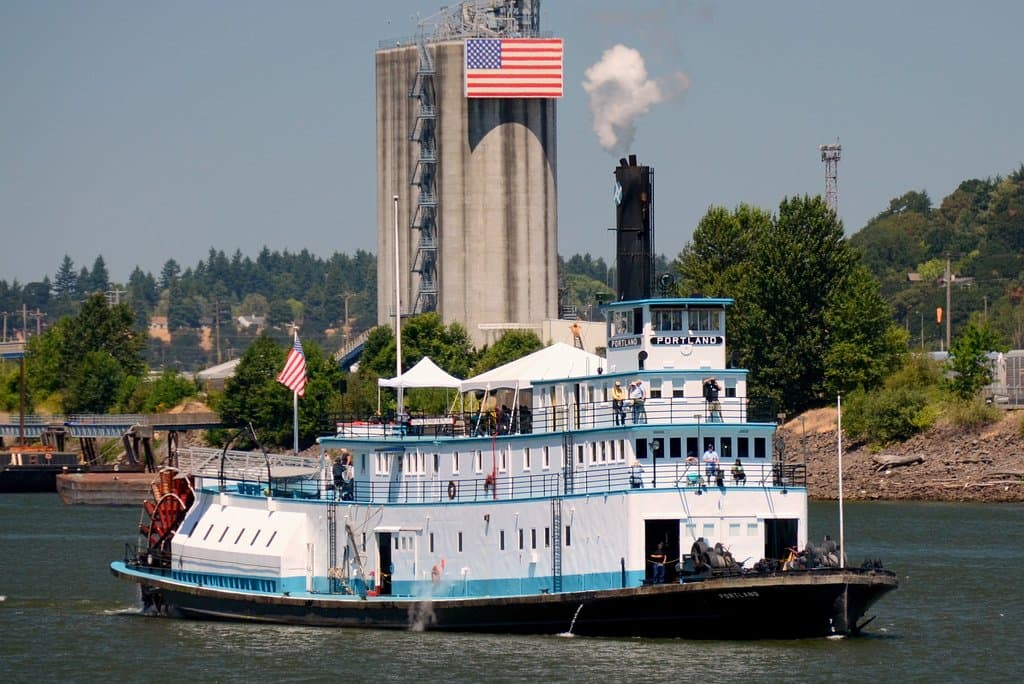 The steamer PORTLAND cruising the Willamette River. The tugboat is usually moored along Naito Pa