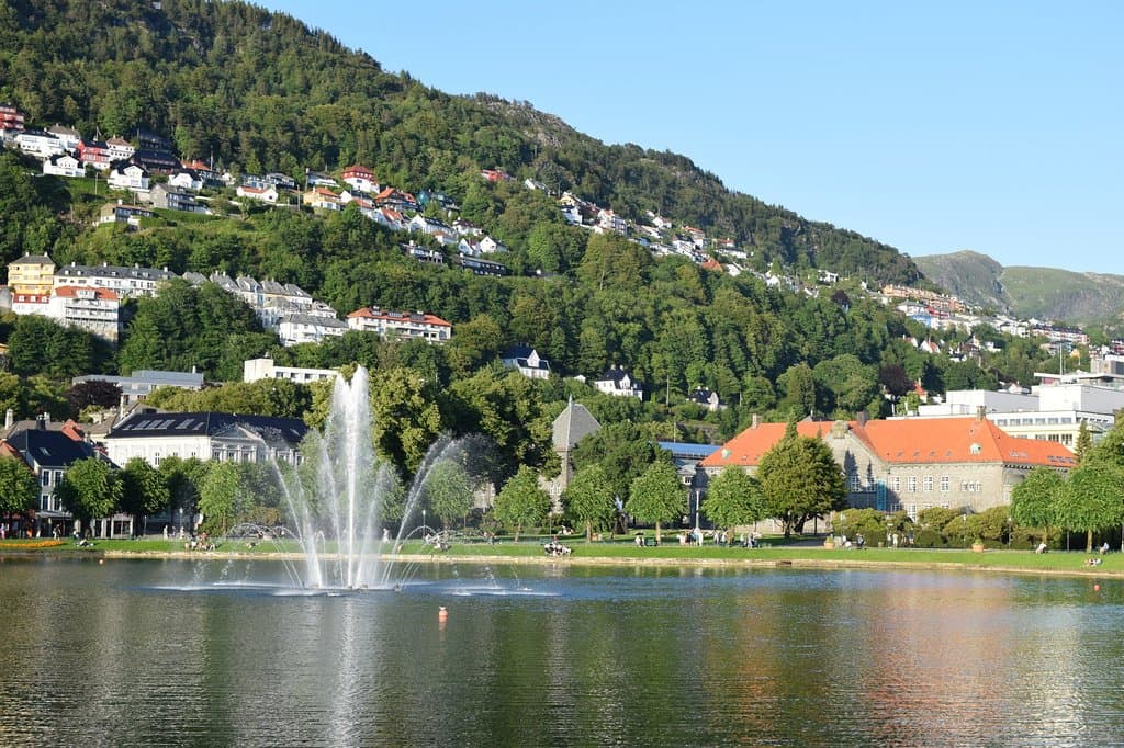 On sunny days a lot of people relax around the perimeter of the lake